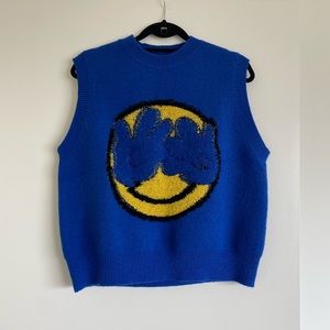 Bright cobalt blue knit smiley face sweater vest